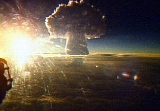 The mushroom cloud of Tsar Bomba seen from a distance of 161 km (100 mi). The crown of the cloud is 65 km (40 mi) (213,000 feet) high at the time of the picture.