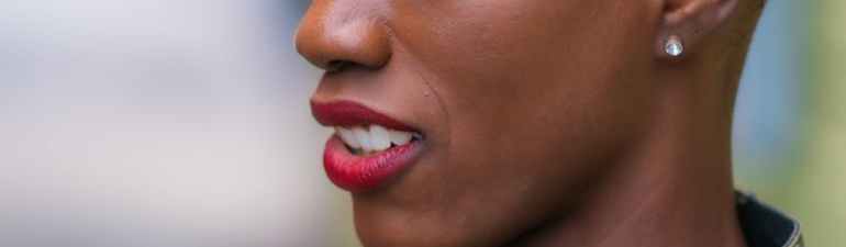 a woman wearing a camouflage top